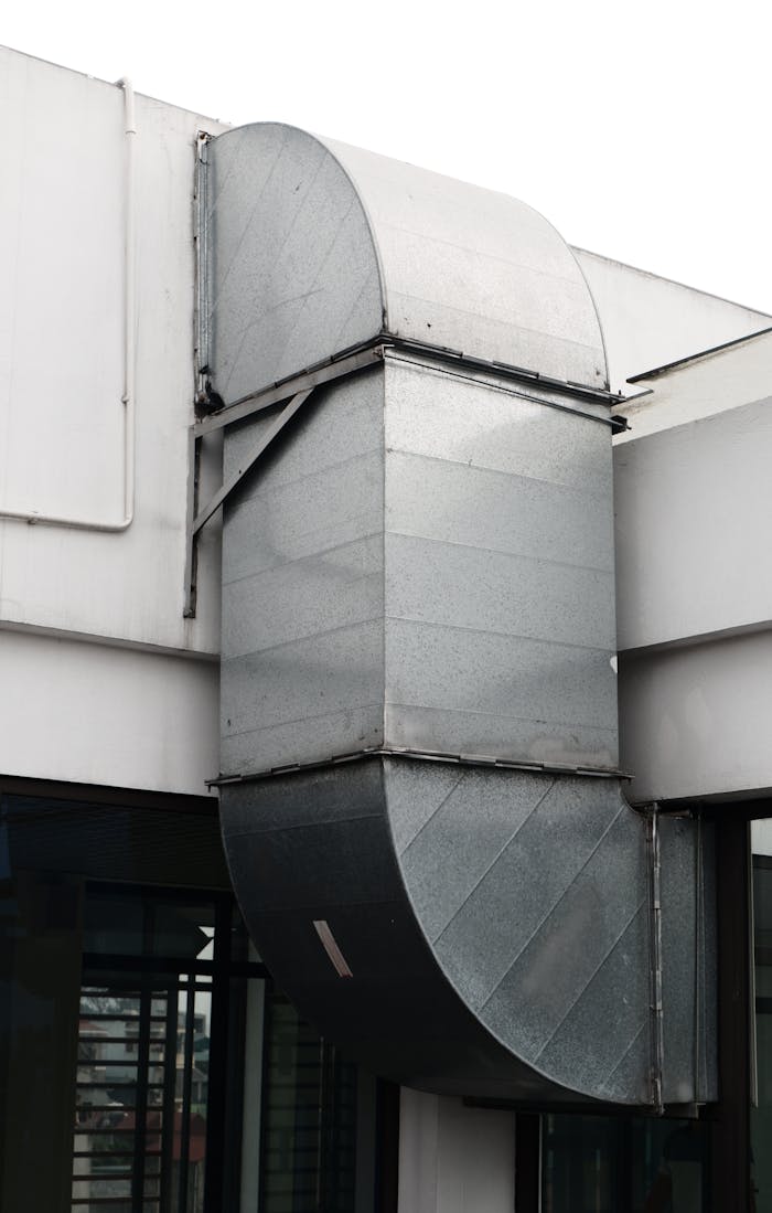 services-04 Close-up of a contemporary ventilation duct exterior in a city setting.